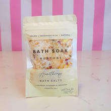 Load image into Gallery viewer, A pouch of bath salts labelled Bath Soak Restore Aromatherapy Bath Salts by Arthur Betsy