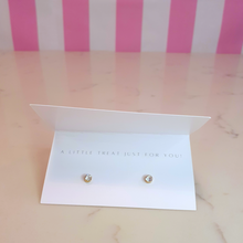 Load image into Gallery viewer, A white card with a pair of gold diamante earrings on it and the message "A little treat just for you!"