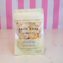 Load image into Gallery viewer, A pouch of bath salts labelled Bath Soak Restore Aromatherapy Bath Salts by Arthur Betsy
